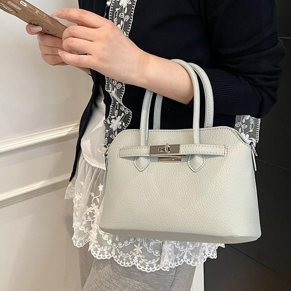 Simple temperament hand bag women's spring new niche fashion messenger bag commuter shoulder bag