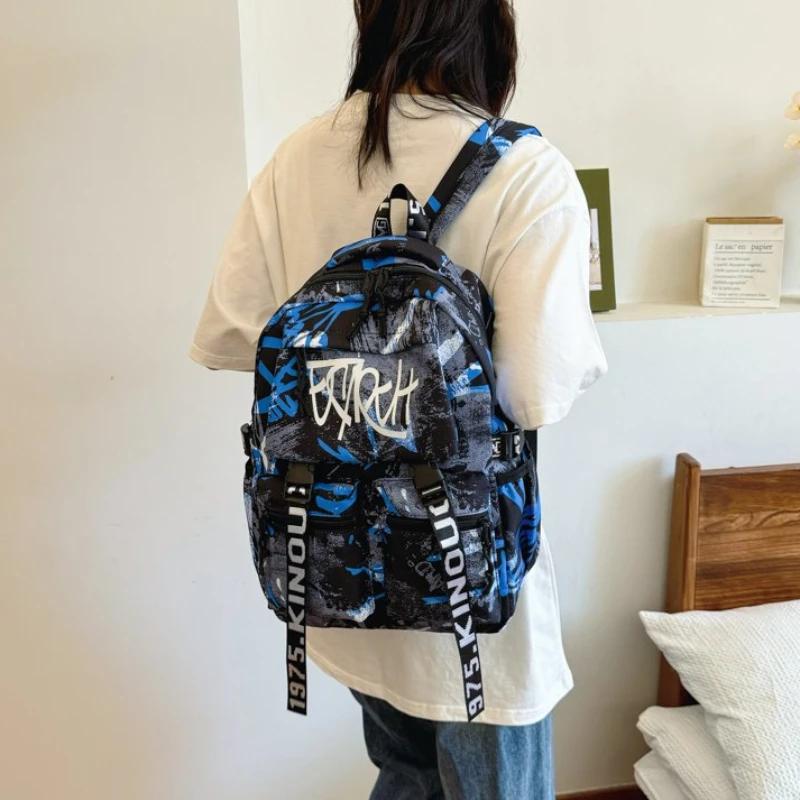 Přizpůsobený pánský nylonový graffiti batoh Velkokapacitní Všestranná verze Korejský cestovní batoh na krátké vzdálenosti pro počítač
