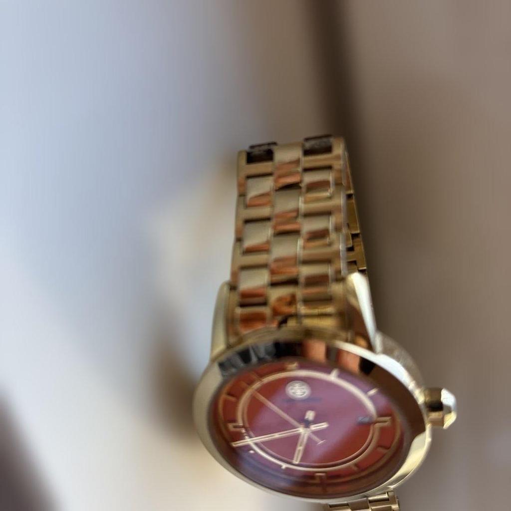 Used Tory Burch gold color watch