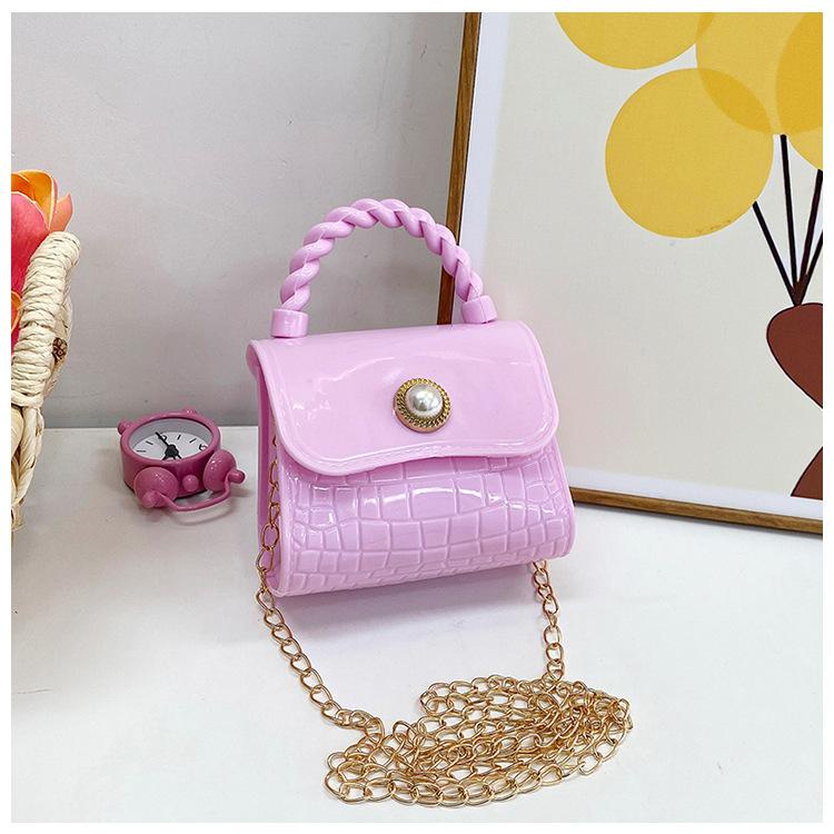 

Дитяча желе сумка корейська версія 2024 літо нова мода дівчина іноземний стиль ins маленька дівчинка змінна сумка приплив рожевий