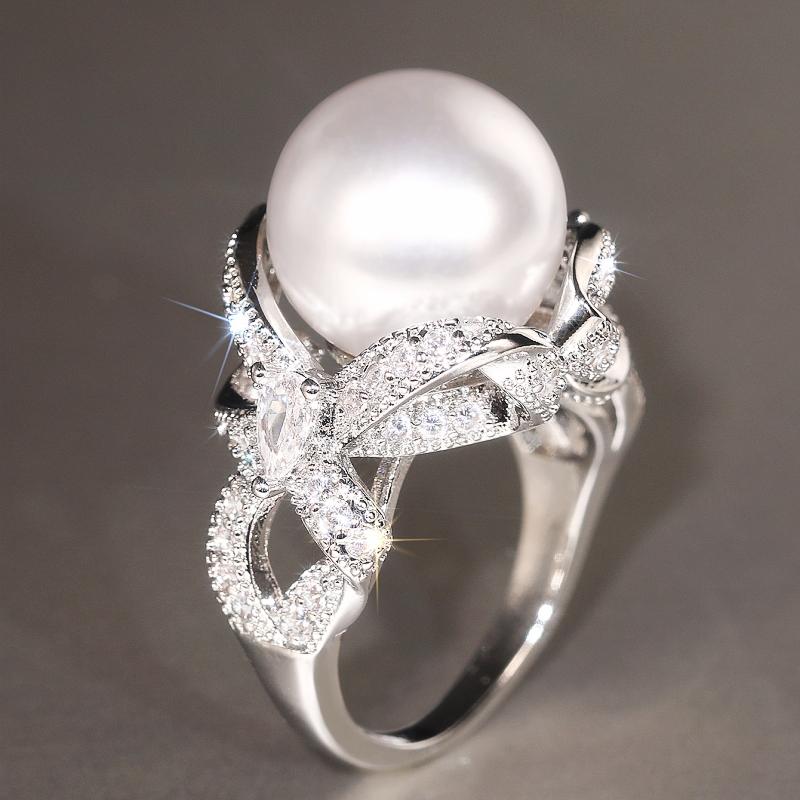 

Huitan Romantic Bridal Wedding Rings Simulated Pearl Sparkling Knot Design Cubic Zircon Rings New Temperament Zircon for Women 7