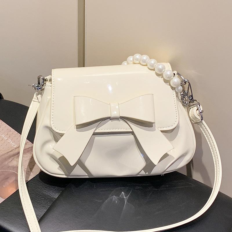 This year, French sweet style bow chain small bags are popular, fashionable and versatile, foreign style and advanced sense messenger women's bags.