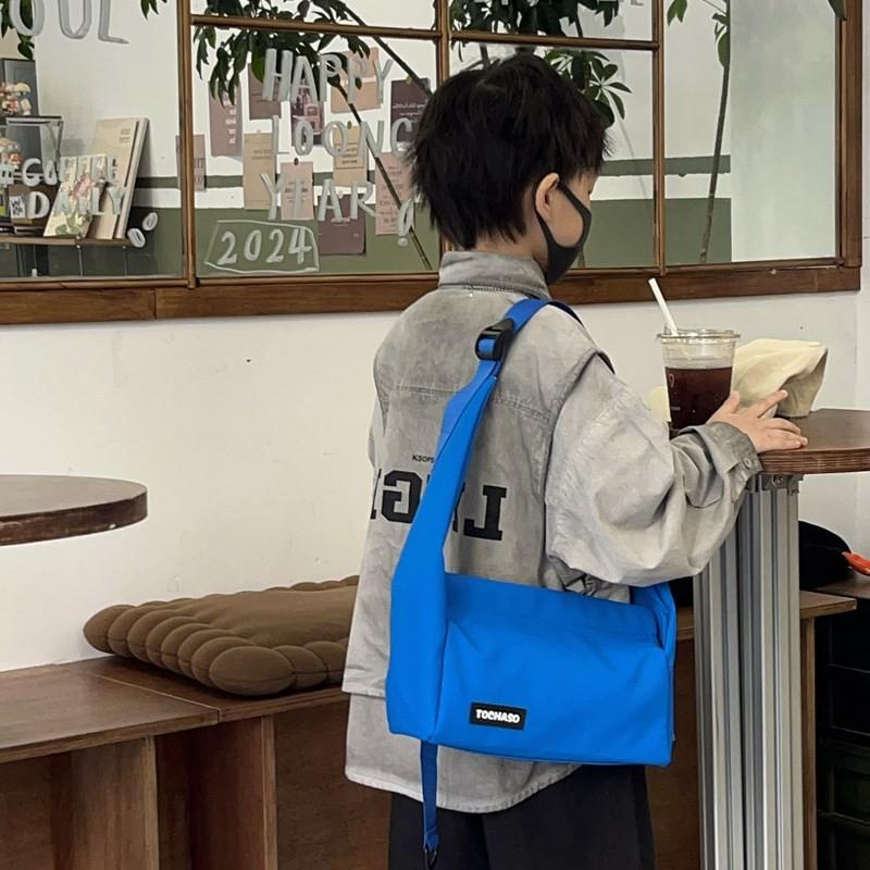 Lightweight Fashionable And Crossbody Bag For Kids Featuring Fun Letter Graphics And Modern Style