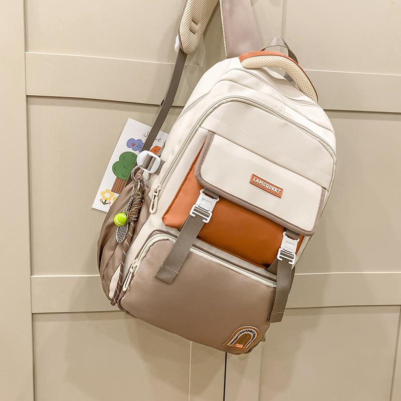 New large-capacity contrasting color schoolbag, waterproof protection for campus students, durable and lightweight backpack, trend research backpack.