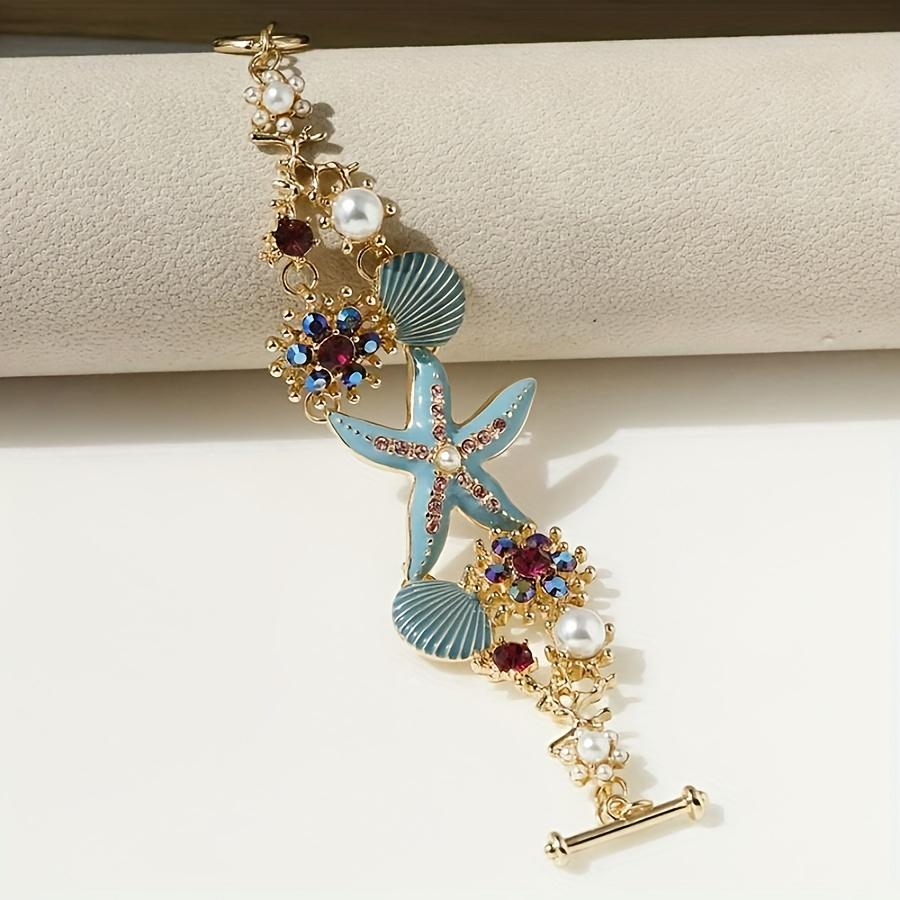 

One gorgeous starfish pendant bracelet with shell details and sea coral beads suitable for beach daily wear and ocean vacation style синій