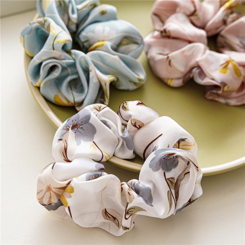 French-style smooth satin scrunchie with floral pattern, versatile elastic hair tie for women, popular on Instagram