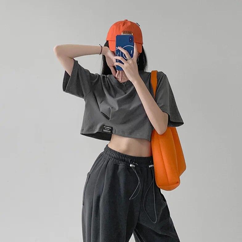 Harajuku მარტივი სოლიდური Crop Top ქალების ყოველდღიური მოკლემკლავიანი მაისური ზაფხულის სექსუალური თავისუფალი ახალგაზრდა გოგოს მოკლე მაისური კორეული ტანსაცმლის ტოპები