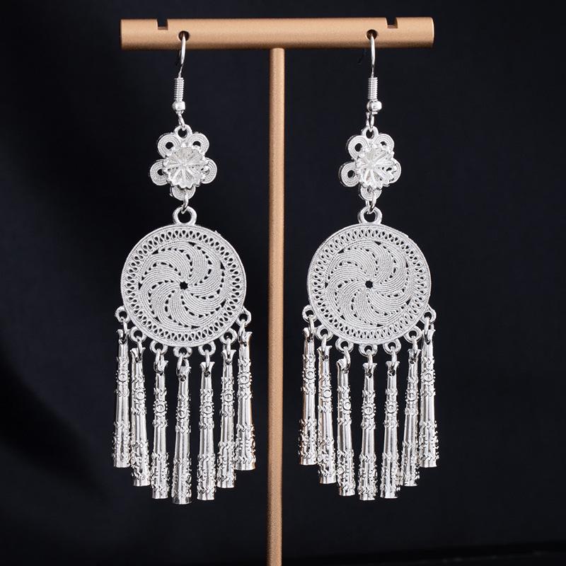 Bohemian Ethnic Miao Silver Tassel Earrings with Butterfly, Peacock, and Flower Design for Women – Long Dangle Jewelry for Travel Photos.