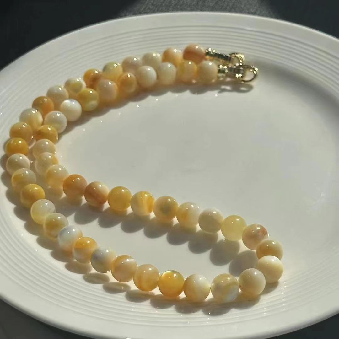 

Deep sea full cat eye fairy shell collarbone chain, round bead family photo necklace Mother s Day gift natural cat eye shell