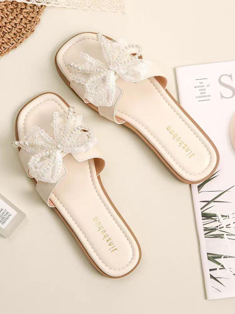 Fairy wind bow pearl slippers female 2025 summer new Korean version of Internet celebrity flat bottom square head cool slippers