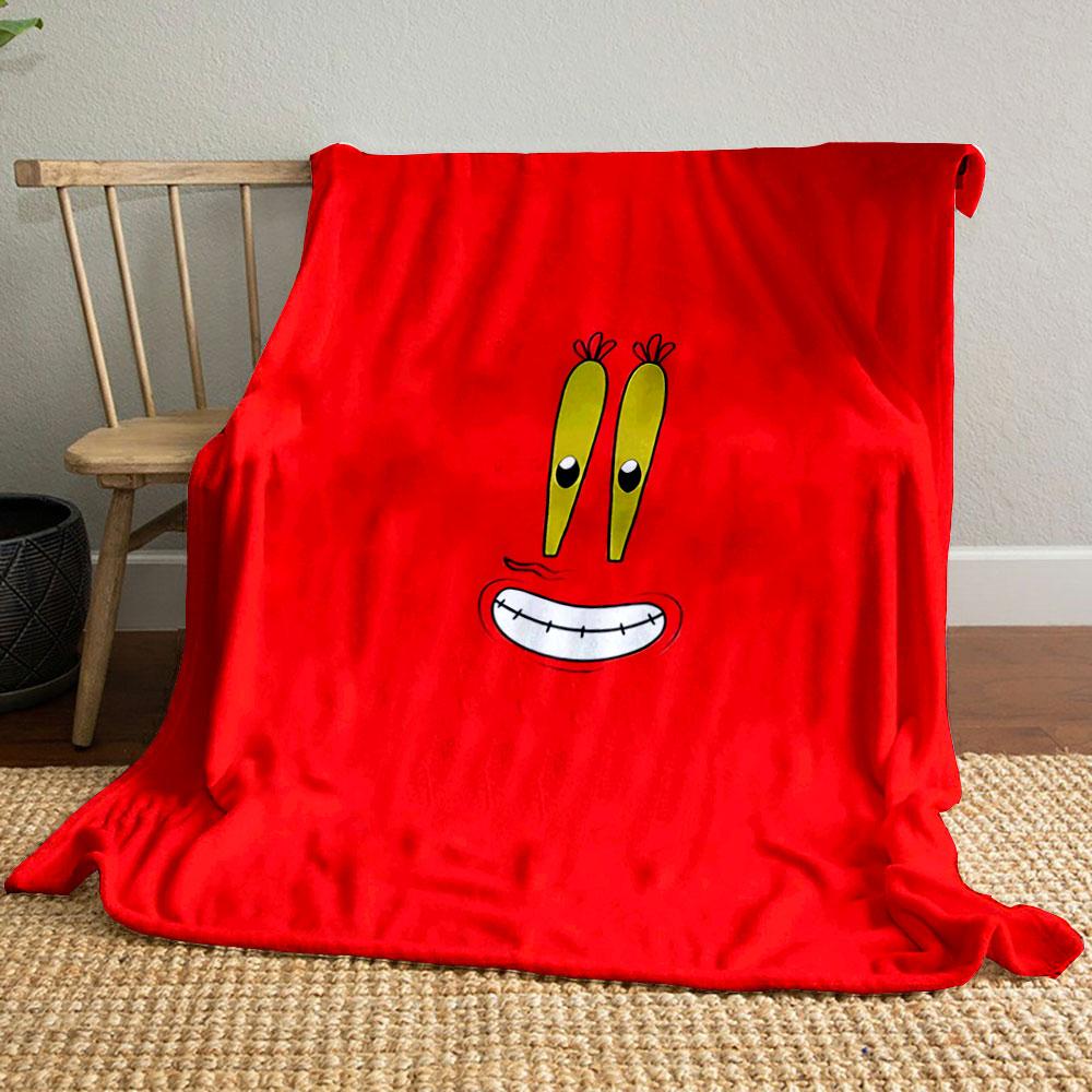 A cartoonish smiling face with big yellow eyes on a red background. for all seasons blanket lunch break throw gift