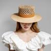 European and American spring and summer new fashion casual hand-woven hollow fleece webbing raffia flat top hat outdoor sunshade straw hat