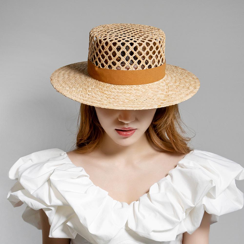 European and American spring and summer new fashion casual hand-woven hollow fleece webbing raffia flat top hat outdoor sunshade straw hat