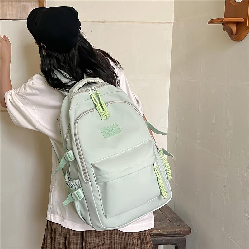 Small and Fresh Middle School Students Backpack Korean Version Large Capacity Lightweight Elementary School Students Casual Backpack