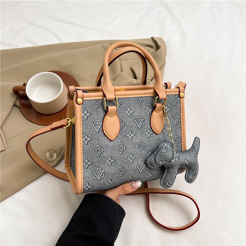 New high-end fashion contrasting color commuter bag portable shoulder oblique span women's bag