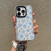 A full-screen light blue floral phone case, iPhone 17 Gentle Style, Apple 16 Pro with a large punch-hole transparent case
