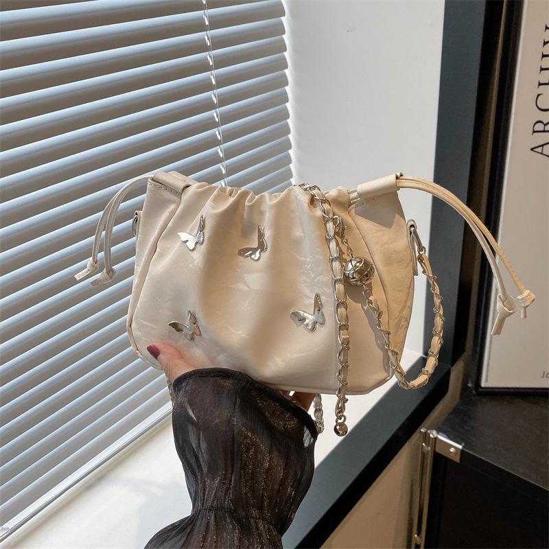 High-End Women's Metallic Bow Bucket Bag - Autumn 2024 Niche Fashion Drawstring Style