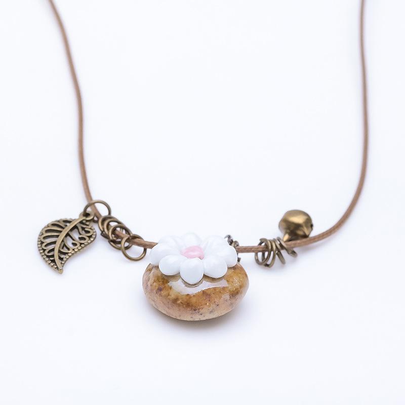 

Stone flowers bloom ceramic pinched flower necklace, female ethnic style handmade retro Mori cute bells simple accessories