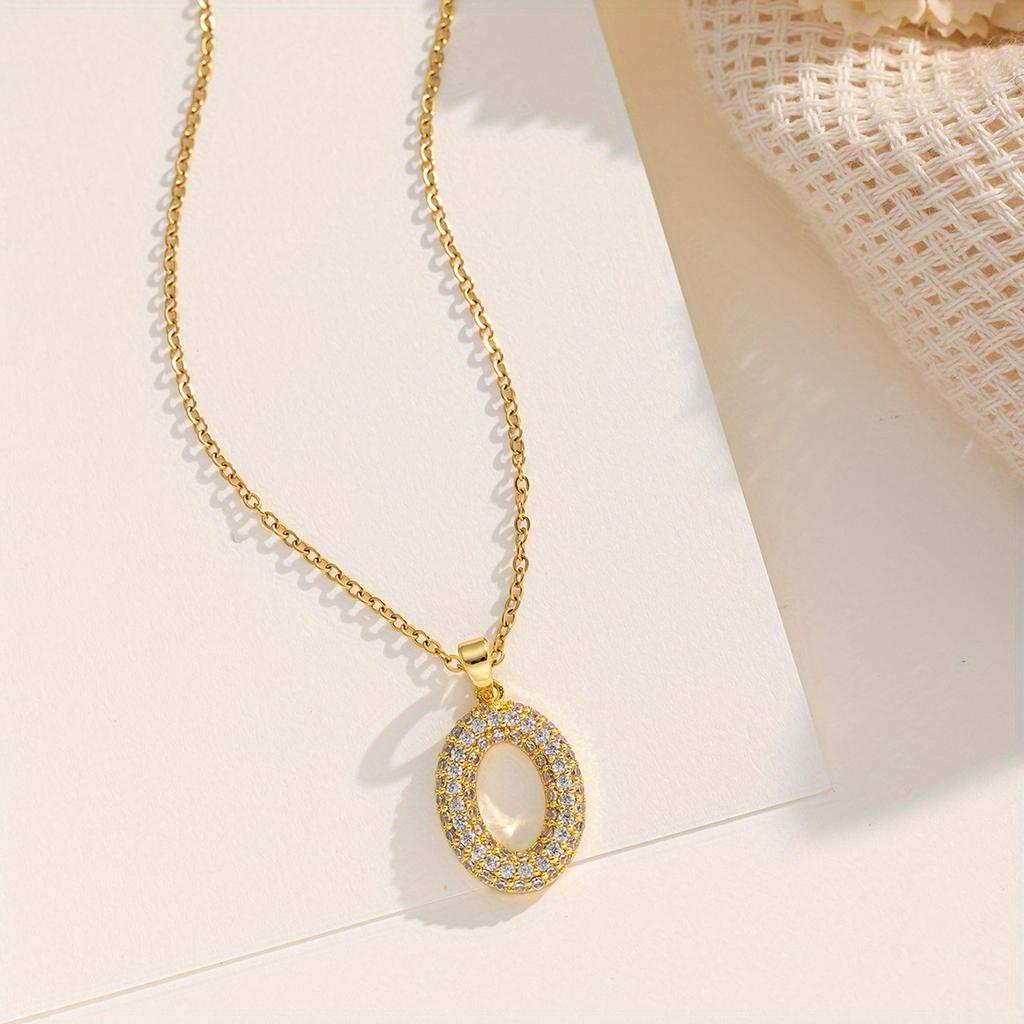 A gold-plated stainless steel chain necklace with cubic zirconia in an oval shape, featuring a creative and unique design, offering a light luxury,