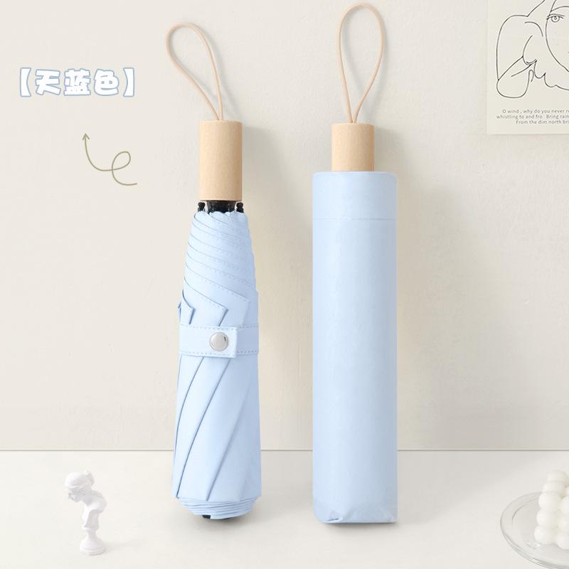 New three-fold simple plain color windproof and sun protection creative solid wood handle female vinyl parasol