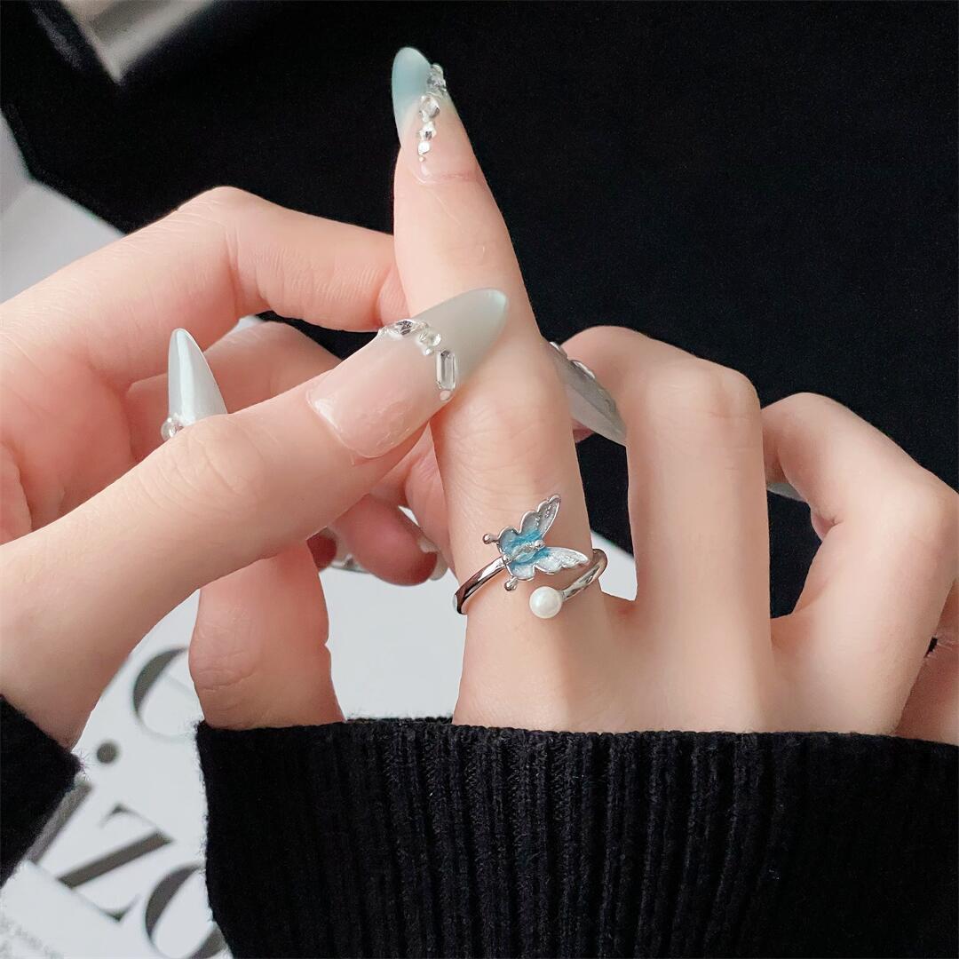 

Small Fresh Butterfly Exquisite Opening Ring Enamel Sea Blue Pearl Niche Design Personalized Winding Ring Woman Adjustable opening
