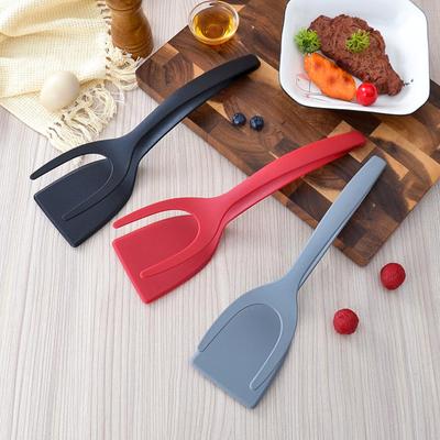 Ustensile de bucătărie multifuncționale din nailon: Spatulă pentru prăjirea fripturii două în unu și agrafă pentru mâncare