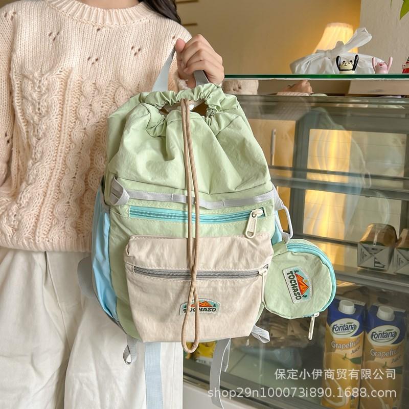 Schoolbag Korean contrasting color Macaron backpack 1011 new lightweight and cute kindergarten schoolbag drawstring backpack wholesale