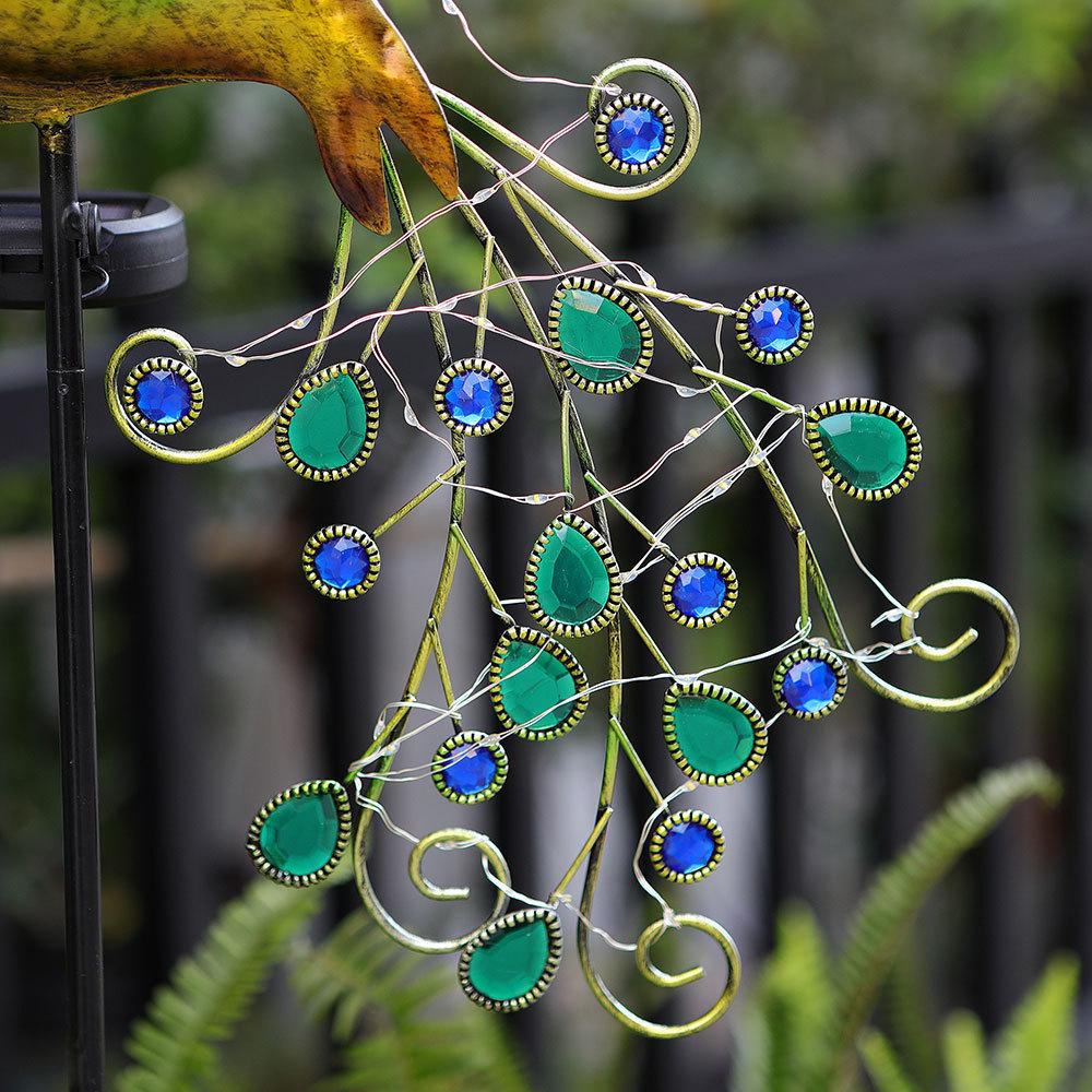 Solar Peacock Light: Waterproof Wrought Iron Garden Ornament for Lawn and Courtyard.
