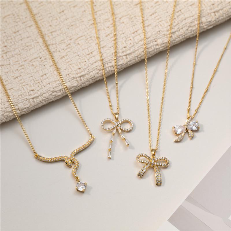 18K Gold Copper Necklace with Diamonds & Zirconia Bow Design