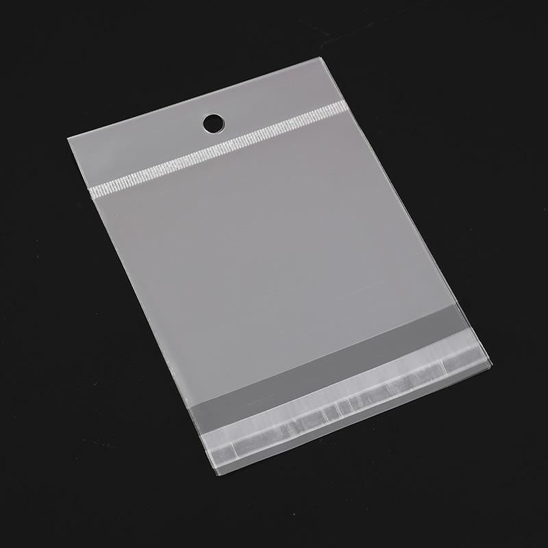 

Прозрачный самоклеящийся пакет для украшений с отверстием для подвешивания и напечатанным логотипом 7*12*7 reinforced straps