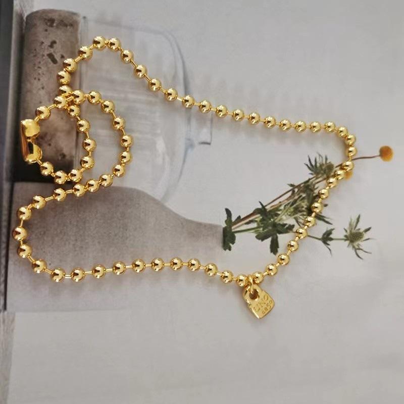 

Trendy brand simple small round bead padlock couple necklace gold silver niche золотий