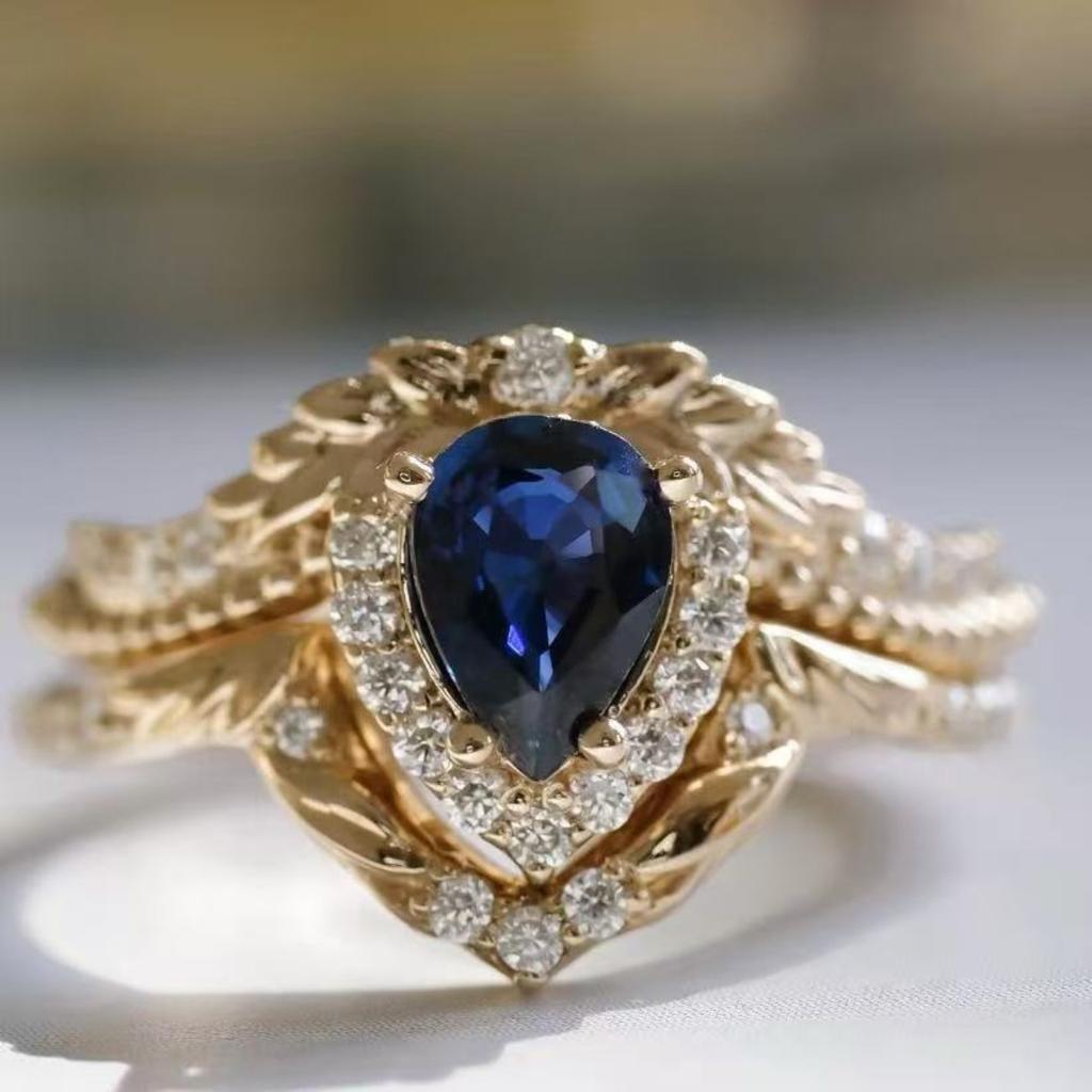 Luxury European and American Flower Wedding Ring Women's Fashion Crown Jewelry Inlaid with Blue Water Drop Zircon Set Ring