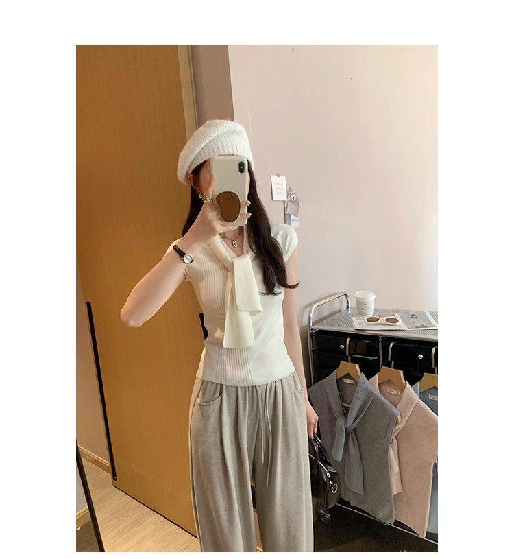 2025 Summer Women's V-Neck Knit Top with Shoulder Pads and Ribbon - Hong Kong Style