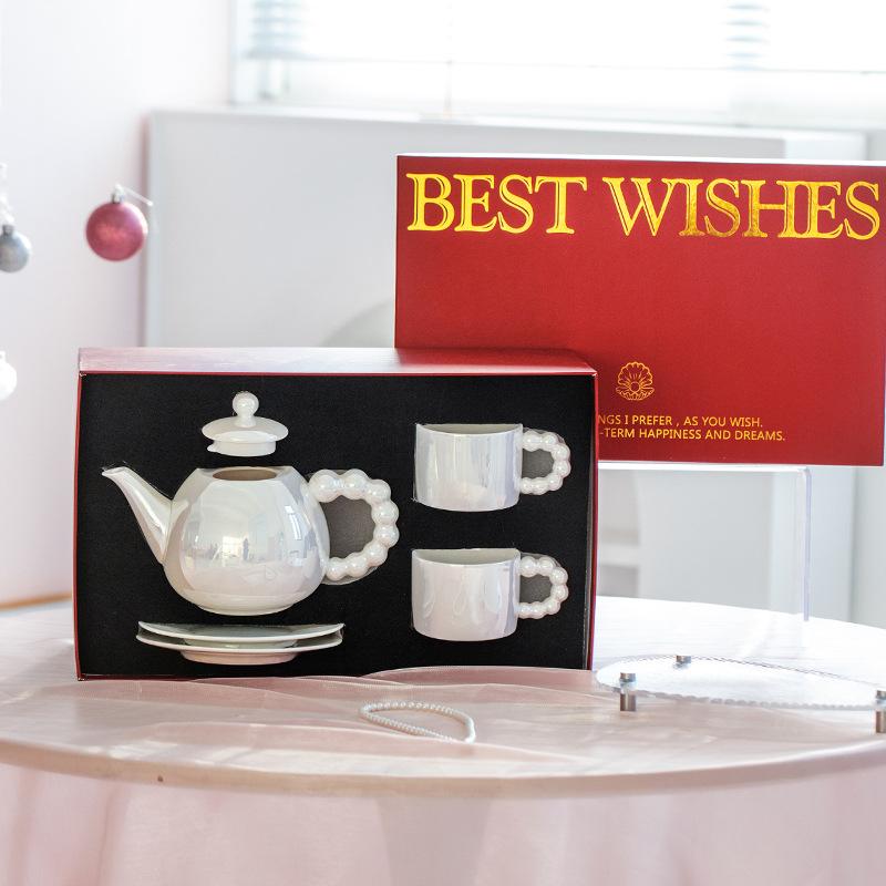 

Легкая роскошь Высокая ценность Жемчужный чайник Скандинавский стиль Домашняя гостиная Чашка для воды Высококлассный подарок Набор посуды для воды Сувенирный подарок Pot 860ml/cup 200ml