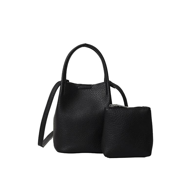 Wholesale simple texture solid color portable bucket bag women's casual versatile light commuter wind messenger mother and child bag
