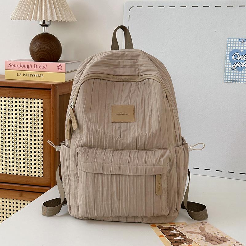 School bag junior high school girls large capacity solid color light primary school backpack high value girl versatile backpack