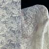 Retro patterned tattoo fabric with base of floral design suitable for wedding dresses formal gowns and designer clothing fabrics