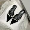Flat bottom pointed sandals women wear summer 2025 new gentle French fairy white pearl bag head half slippers