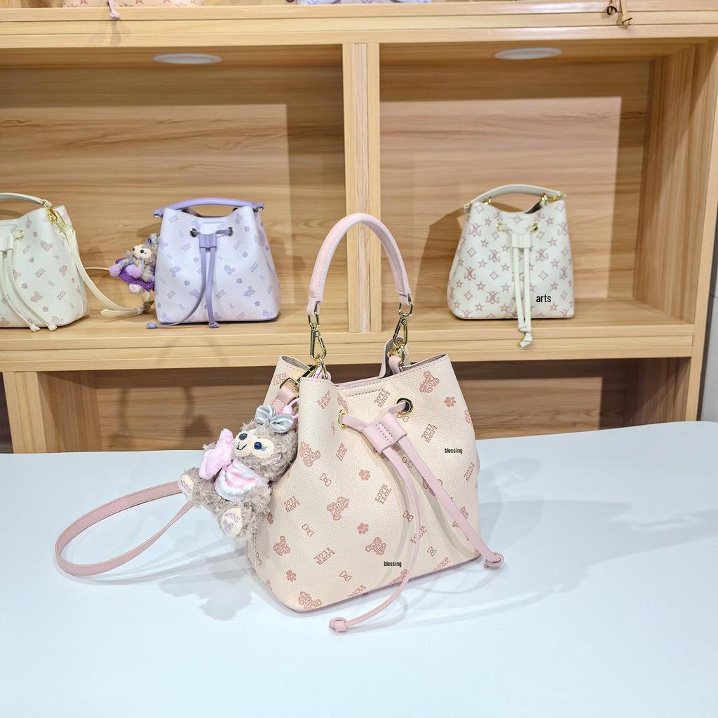 Women's Large Capacity Single Shoulder Bucket Bag with Inner Lining, Compartment Organizer, and Zippered Middle Section.