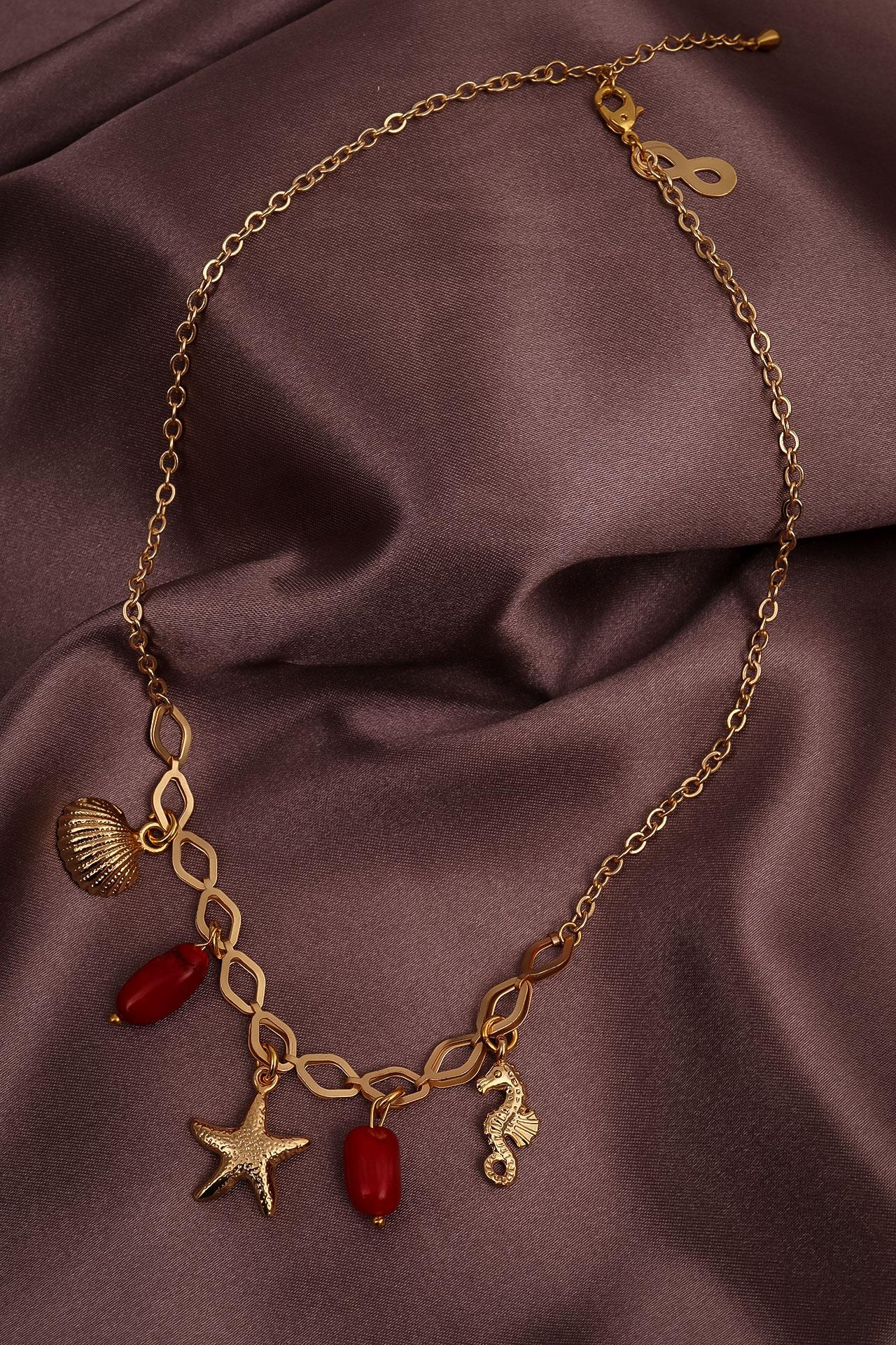 

Ожерелье с подвеской из коралла и морской фигурой