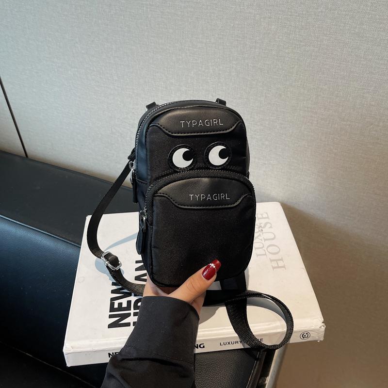 

Niche simple daily shoulder canvas mobile phone bag women s summer new crossbody small square bag чорний