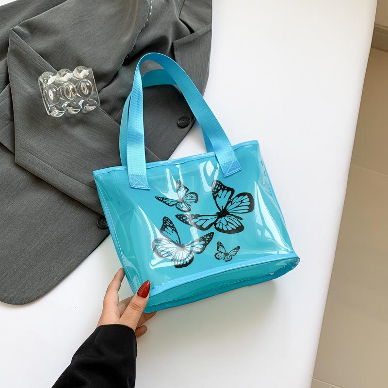 

Casual jelly solid color transparent bag 2024 summer bag large capacity women s shoulder bag new fashion tote bag синій