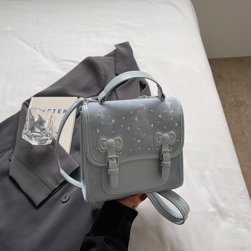 

2025 лето новый рюкзак женский модный повседневный портативный корейская версия студенческий школьный рюкзак милая высокая ценность сумка на плечо