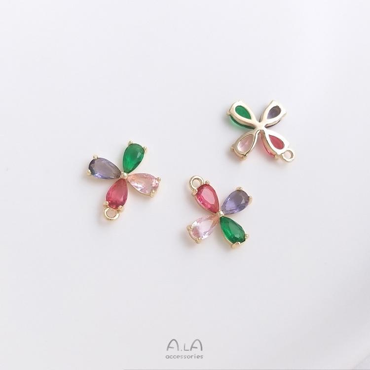 Kolczyki/naszyjnik z zawieszką w kształcie kwiatu z tęczowym okiem, wypełnione 14-karatowym złotem, z kolorowym cyrkoniem.