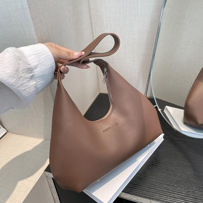 Hochwertiges Nischen-Design Vielseitige Pendler-Retro-Schulter-Baguette-Achseltasche Halbmond-Knödel-Damen-Tasche Tide