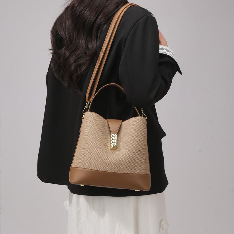 Large-capacity versatile bucket bag, commuter bag, simple and high-end women's bag, new shoulder portable messenger women's bag.
