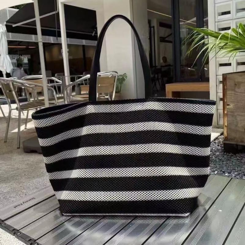 Korean version of large-capacity tote bag cowhide splicing contrasting color bucket bag summer new hollow woven bag lazy wind bag