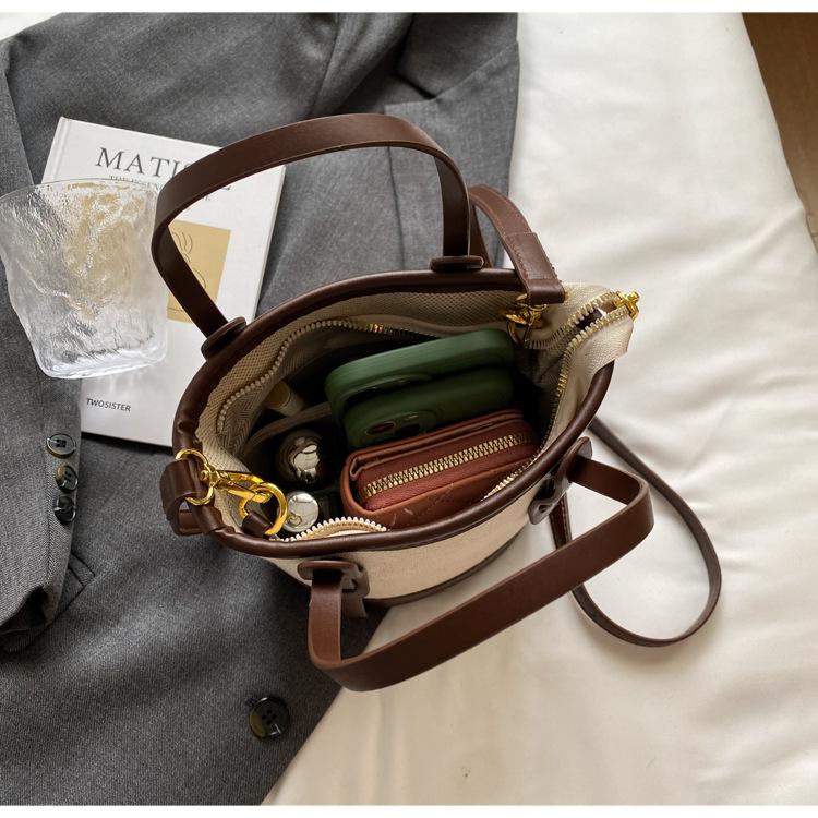 1 szt. 2025 Wybuchowa kontrastowa torba typu wiadro damska uniwersalna torba na ramię do pracy w mieście prosta torba premium wiatrówka