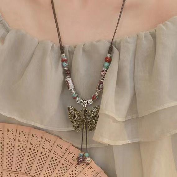 Retro pendant, ethnic style ceramic butterfly bell necklace, women's new trendy long sweater chain with accessories