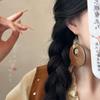 New Chinese wood hollow round pendant earrings fashionable retro simple ear hook niche high-end earrings
